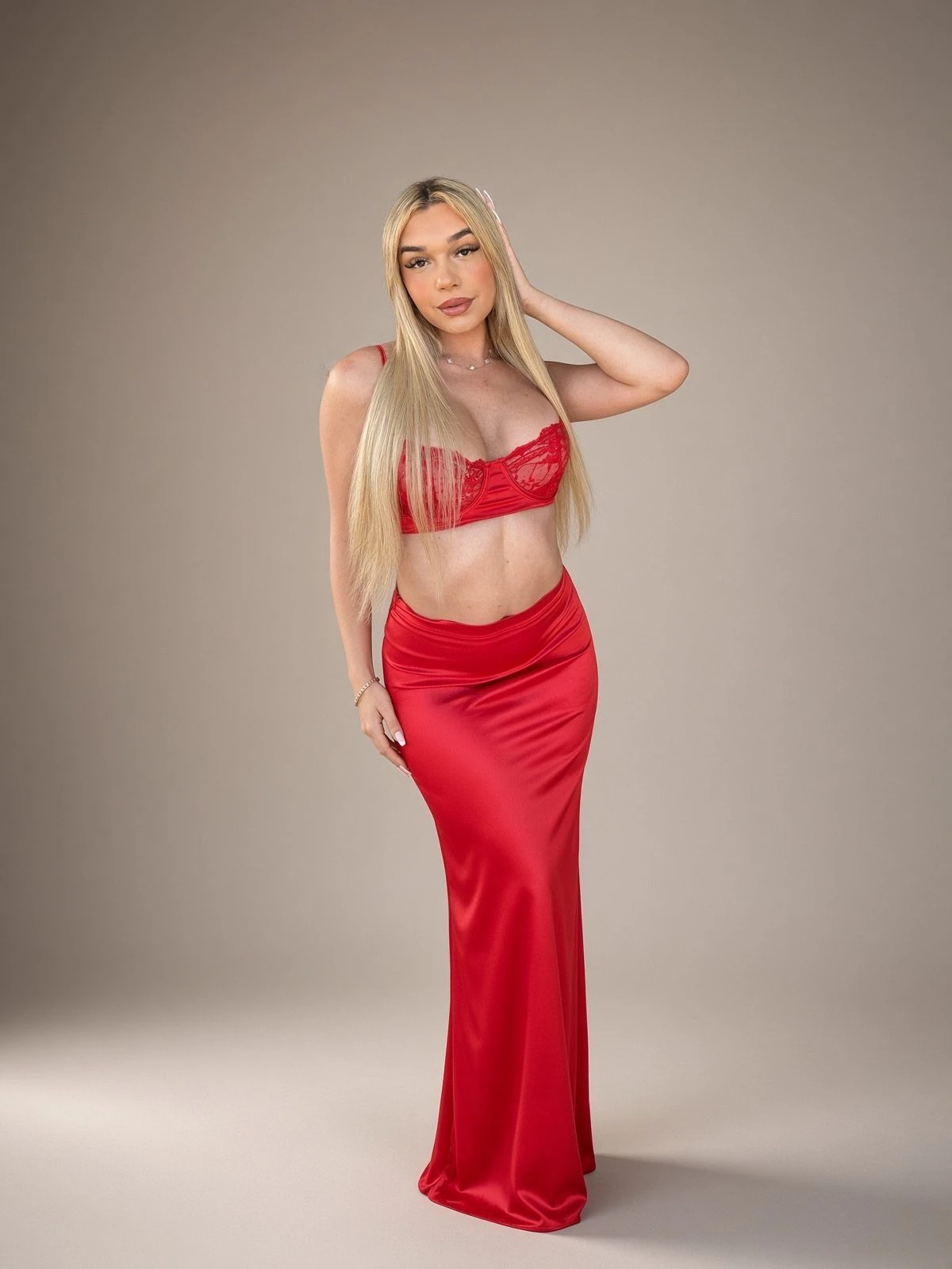 A red gown in warm light.